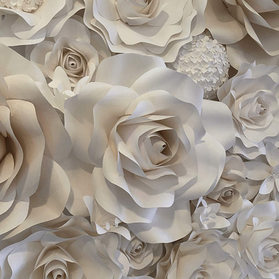 Neutral white flower wall with layered paper roses